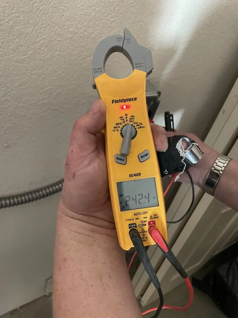Voltage testing with clamp meter during Outlet Installation in Branford